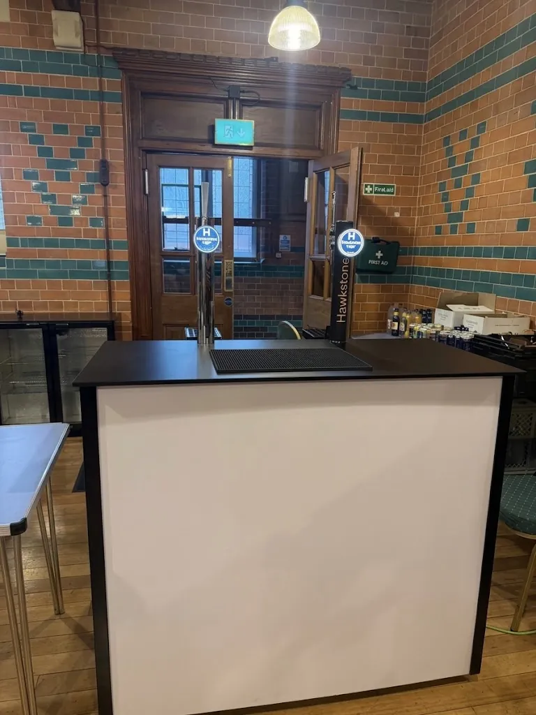 White-fronted mobile bar with double-door bottle fridge at Cheltenham Ladies' College