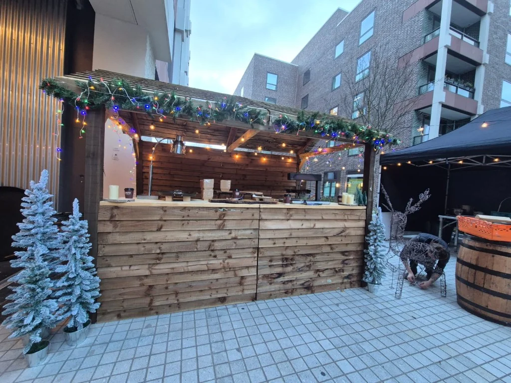 Alpine-style wooden Christmas market hut at St Pancras Campus, central London