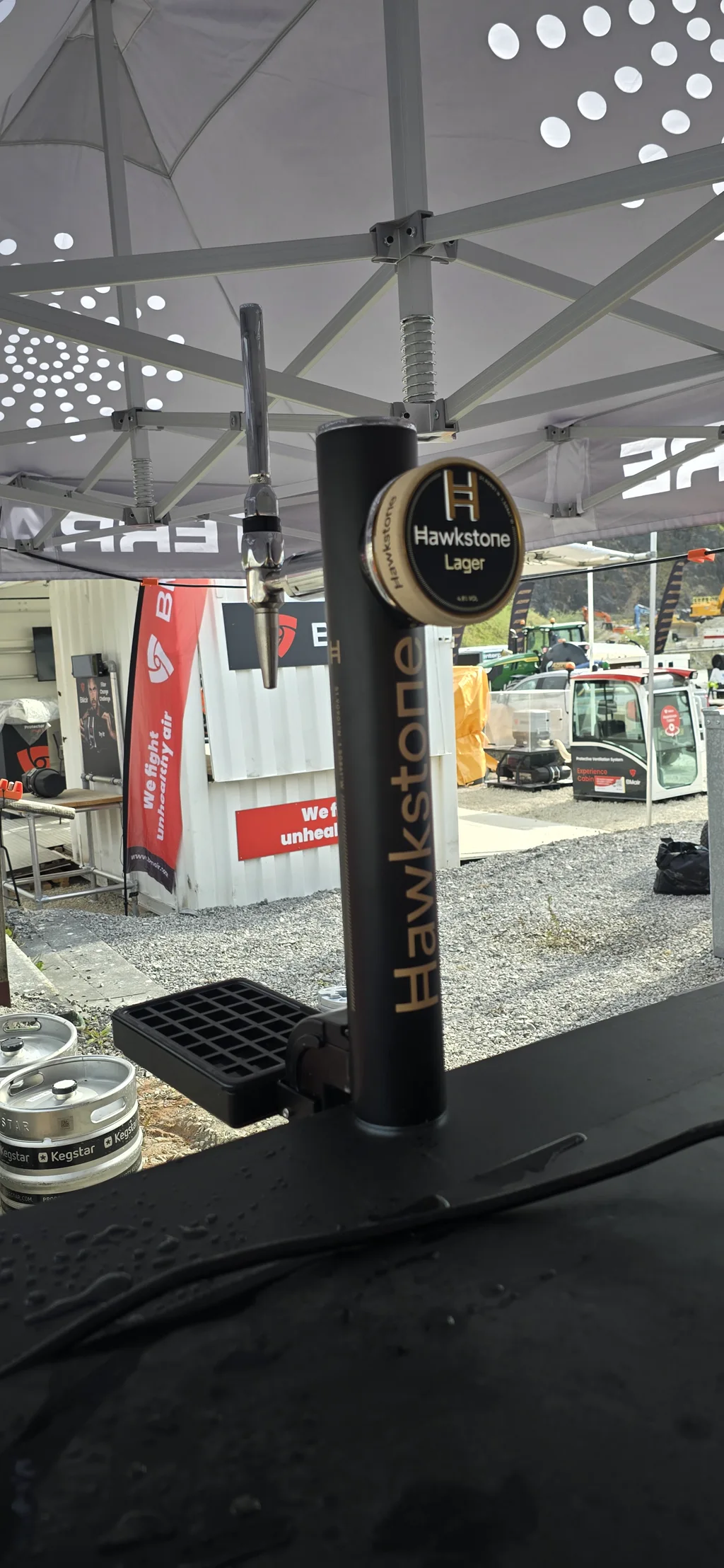 Branded Hawkstone Lager tap at Hillhead outdoor quarry show, Buxton
