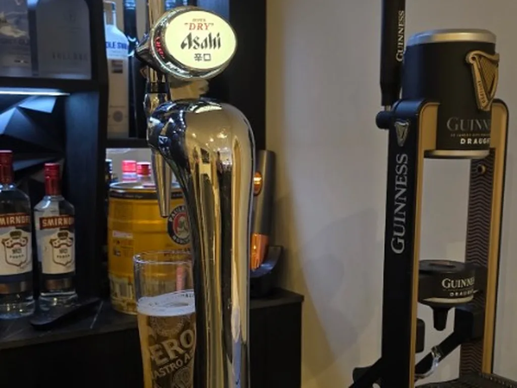 Asahi Super Dry tap and Guinness MicroDraught on a marble bar in Clifford Chambers