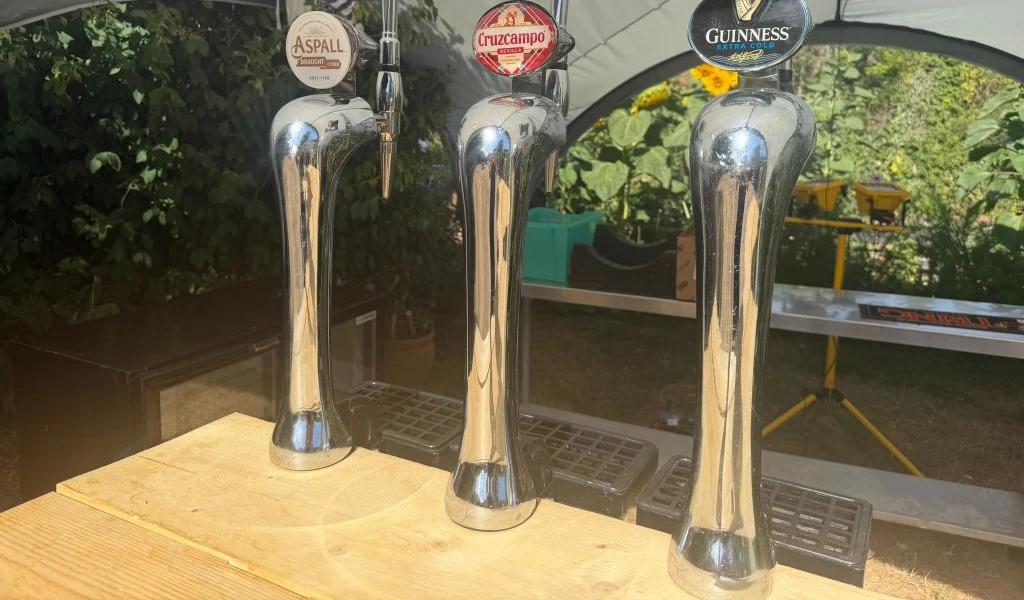Cruzcampo, Aspall and Guinness Extra Cold taps in the garden at The Rising Sun, Ickford