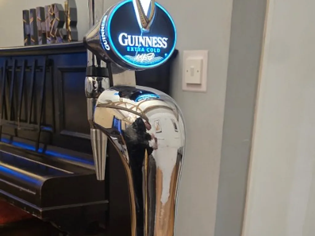 Guinness Extra Cold chrome tap at a private Airbnb in the Peak District