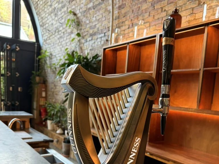 Guinness harp font on the bar at 100 Barrington, Brixton