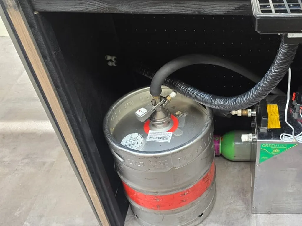 Guinness keg, flash cooler and gas inside the portable bar at Bumble's office in Soho, London