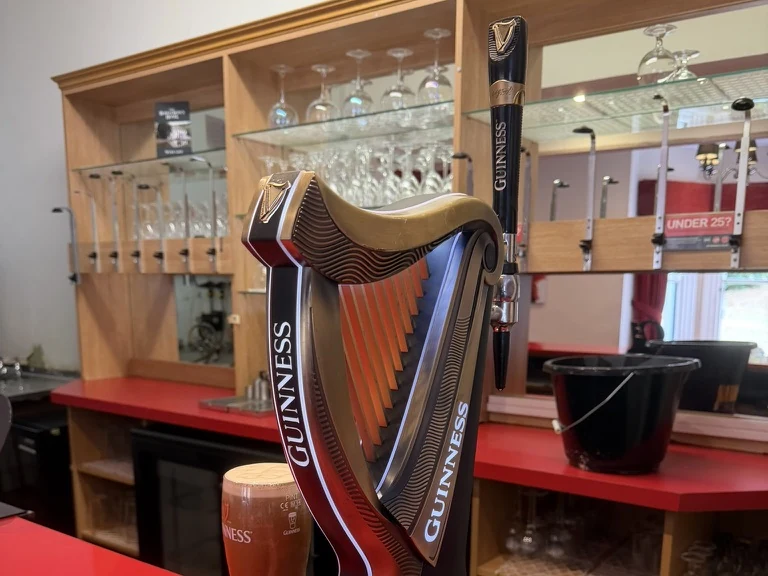 Guinness harp font and a poured pint at the Old Rose and Crown Hotel, Lickey Hills