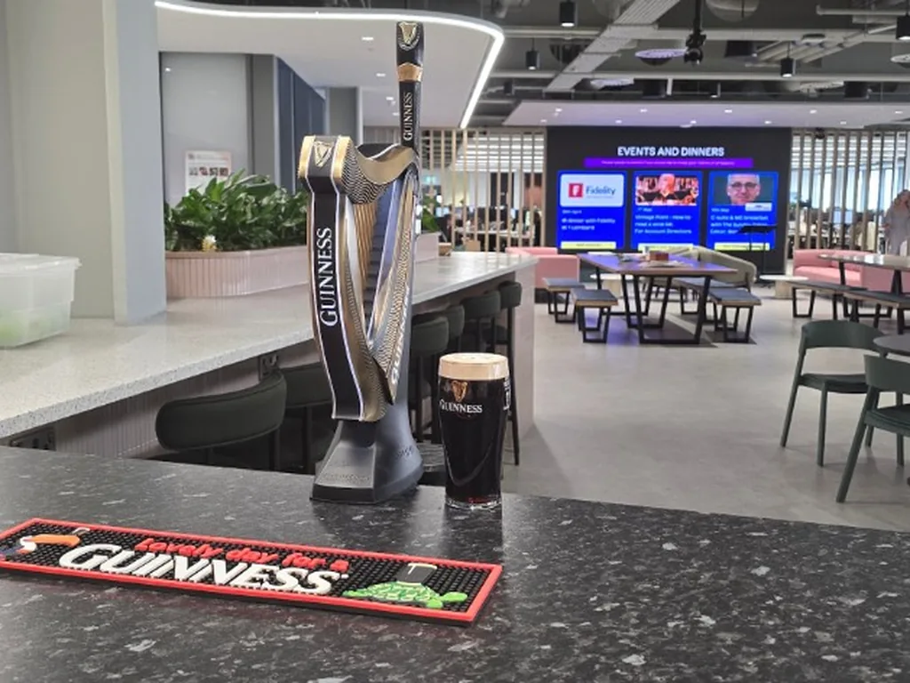 Guinness harp font and poured pint in an office near Waterloo, central London