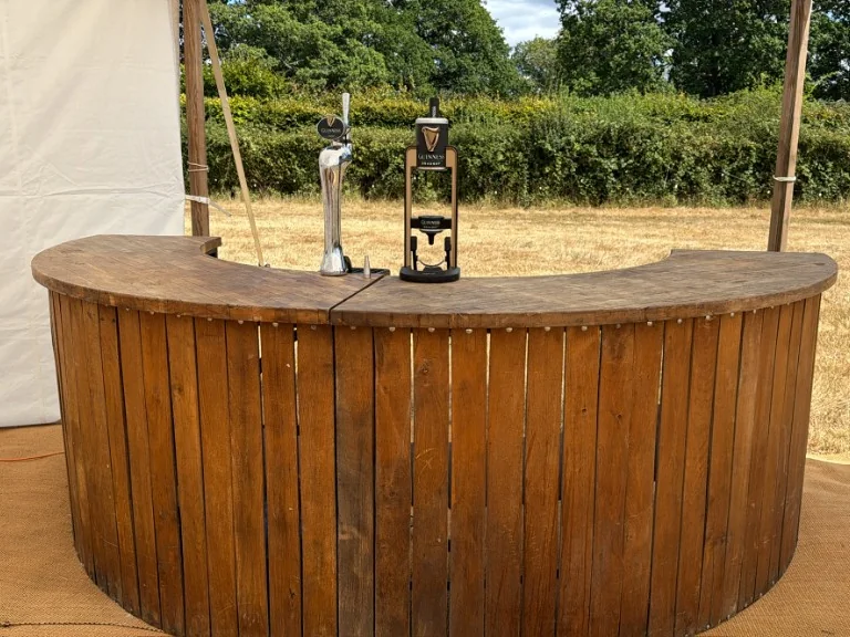Guinness 0.0 MicroDraught beside a Guinness keg tap on a rustic wedding bar in Surrey near Bolney