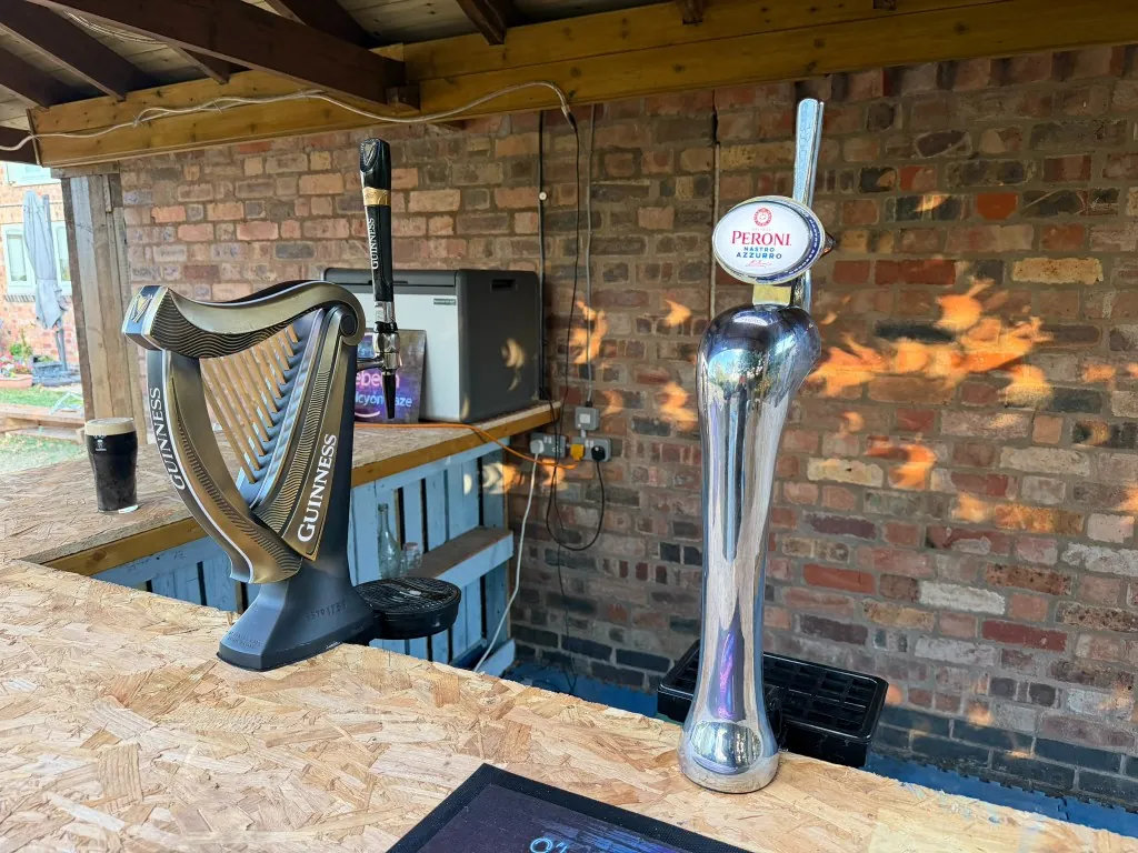 Guinness and Peroni keg hire on a garden bar near Coventry