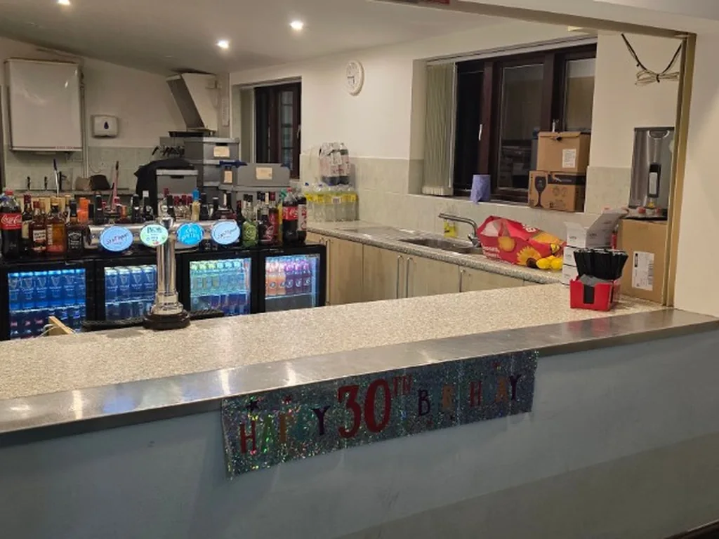 Bar set up in the serving hatch at Lifford Hall, Broadway, for a 30th birthday
