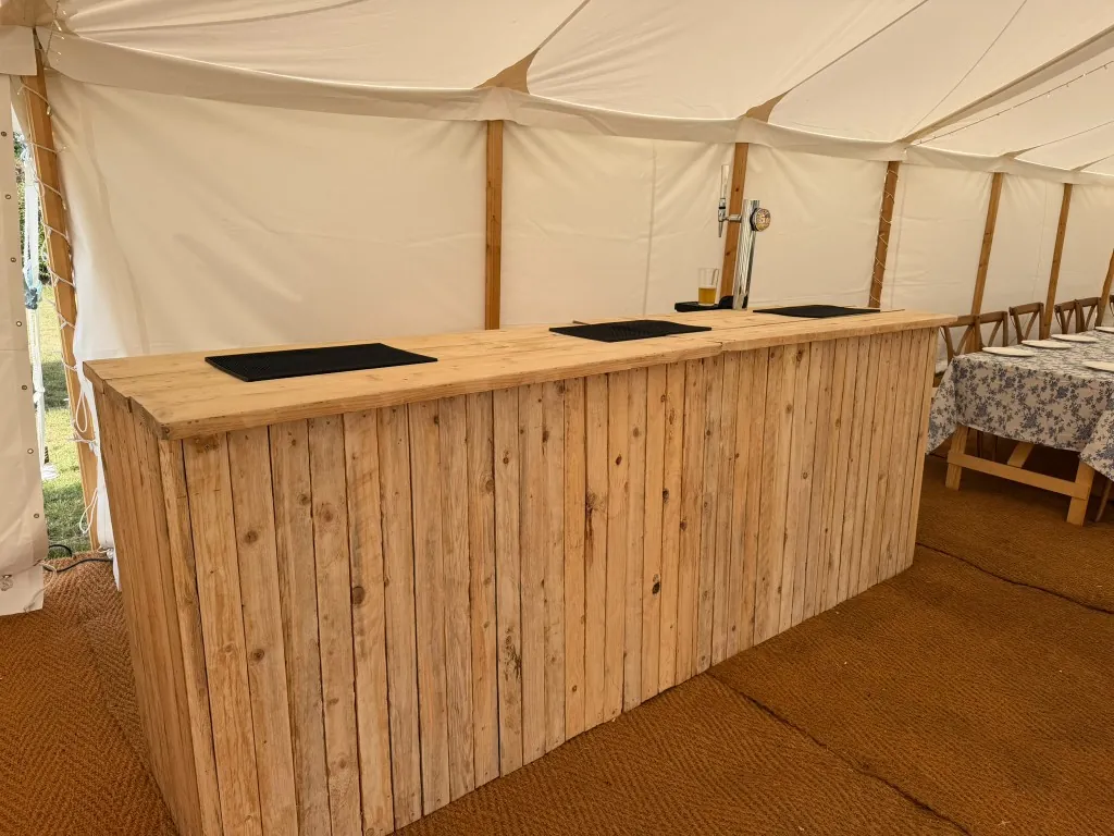 Rustic wooden bar unit hire in a Leicestershire wedding marquee