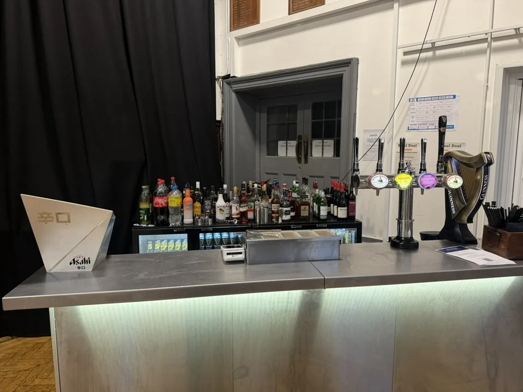 Plain stainless portable bar with underlighting, Asahi ice bucket and a Guinness harp tap at Raynes Park High School
