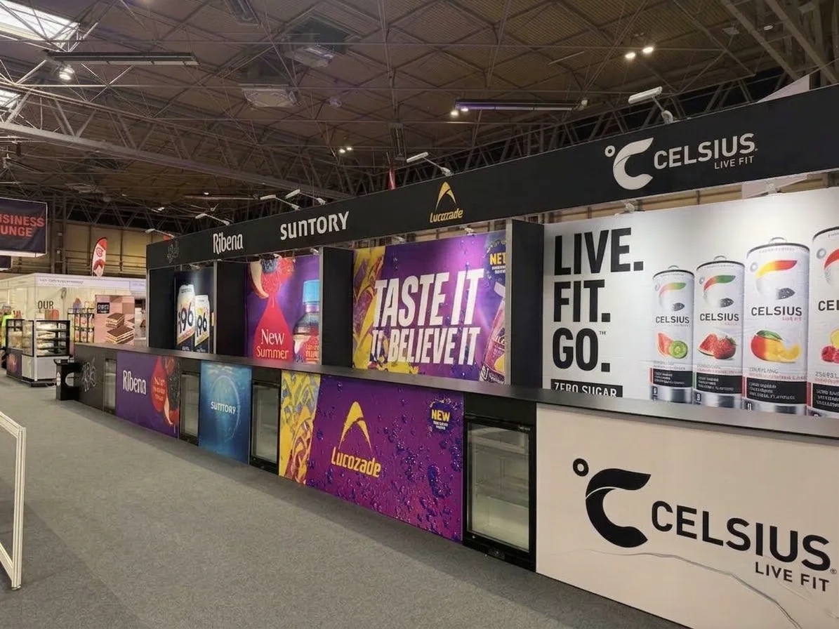 Close-up of Suntory NEC trade show bar frontage showing brand POS and chilled storage